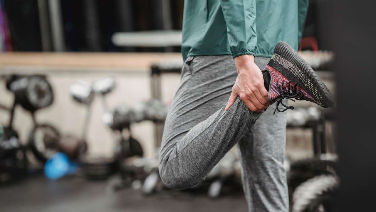 fit man in sportswear training indoor