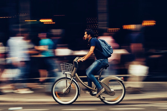 Man riding bicycle to be fit