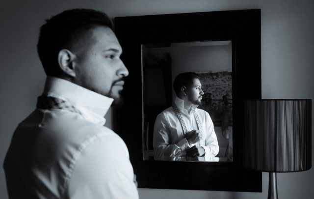 man looking in mirror