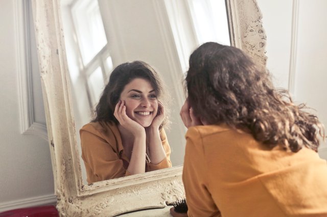 women looking in mirror