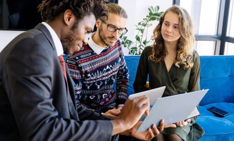 A life insurance agent explaining the benefits of life insurance to a family