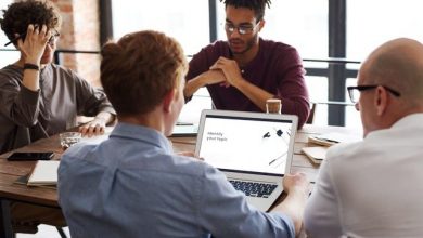 Men sitting on table at an SEO agency