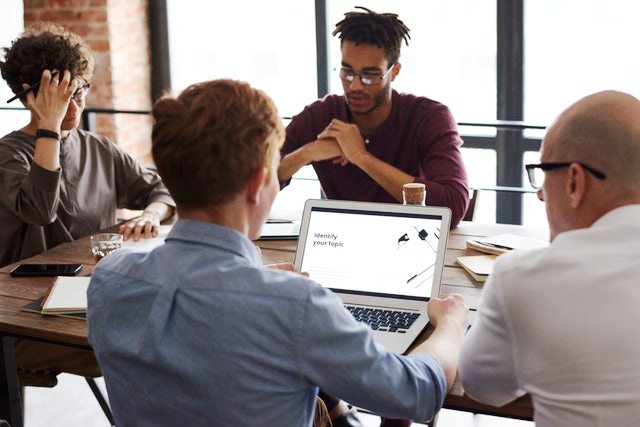 Men sitting on table at an SEO agency