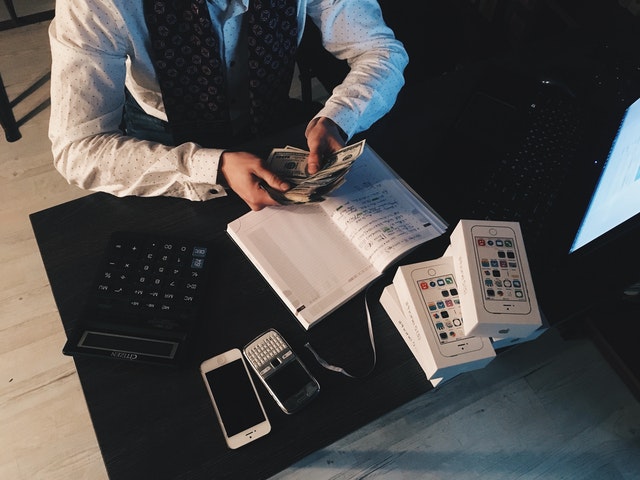 wealthy man counting money