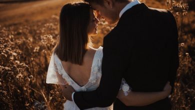 A married about to get married hugging each other from behind