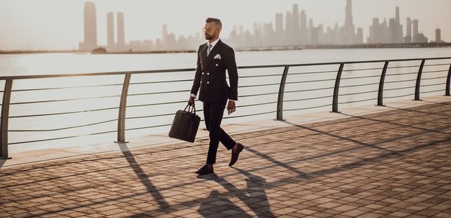 A business man walking down the street for an Business Agreement