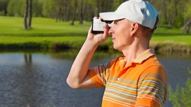 A man using Golf Rangefinders