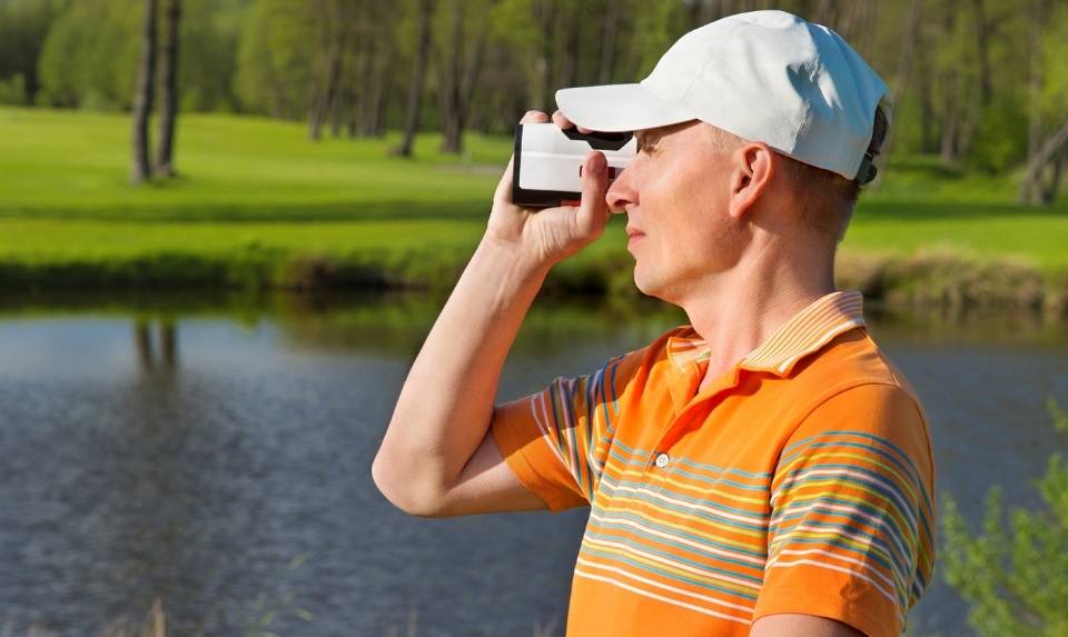 A man using Golf Rangefinders