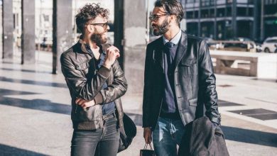 Fashionable guys talking to each other