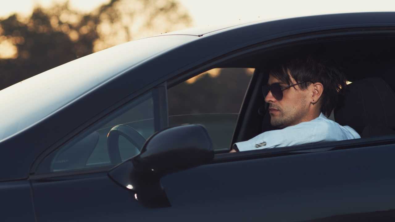 A guy driving his car