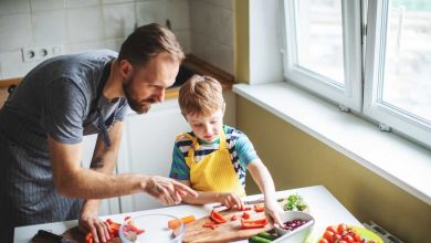 Father and son preparing food