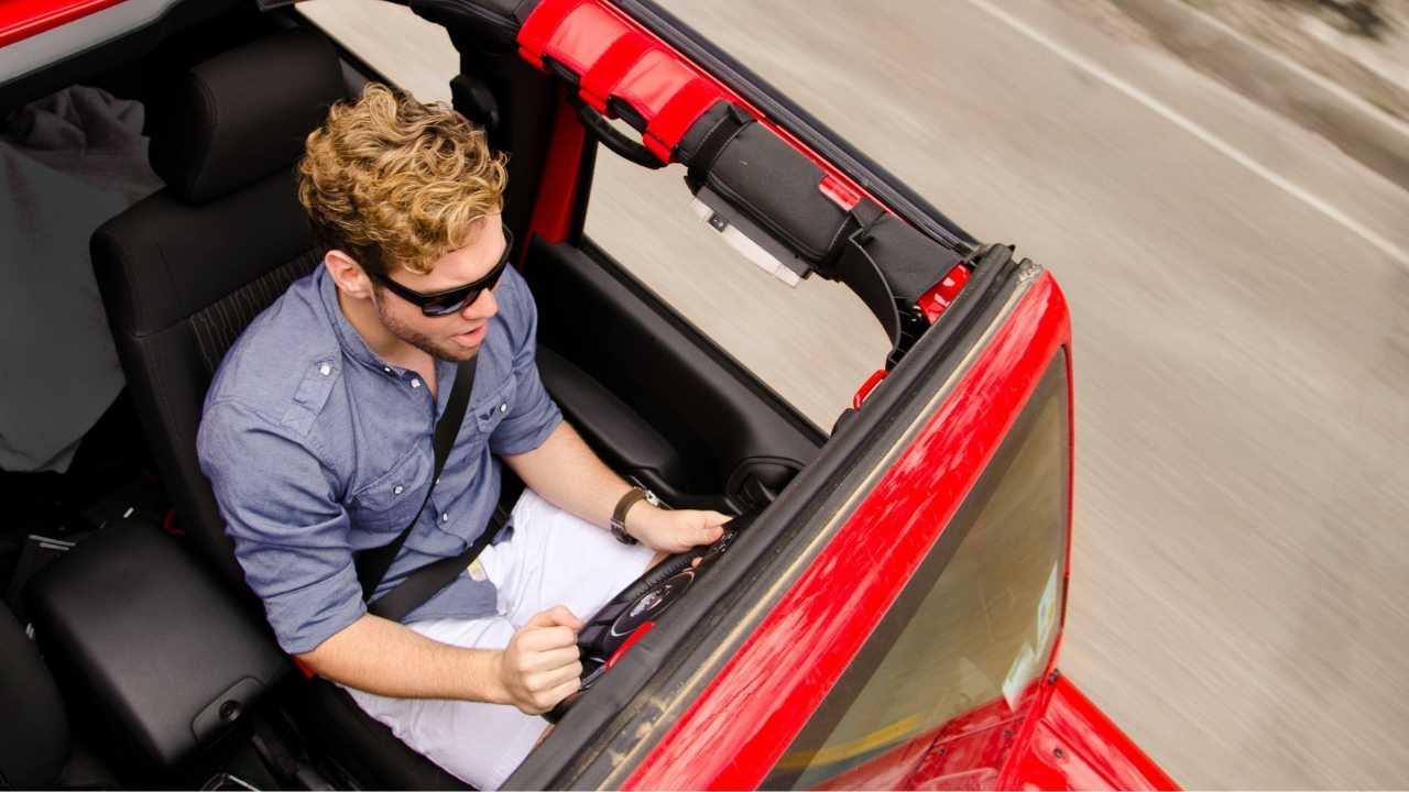 man driving a vehicle