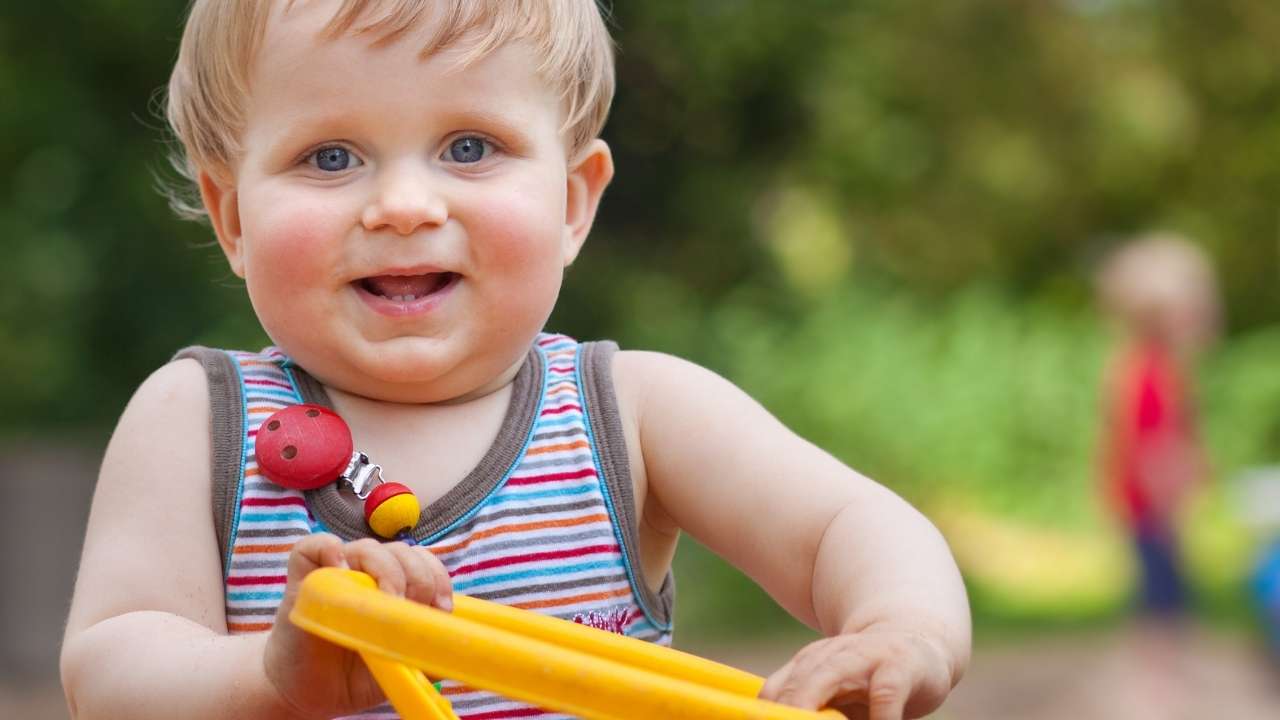 1 Year Old baby with a toy