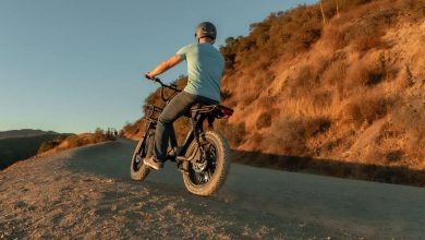 A man riding a e-bike