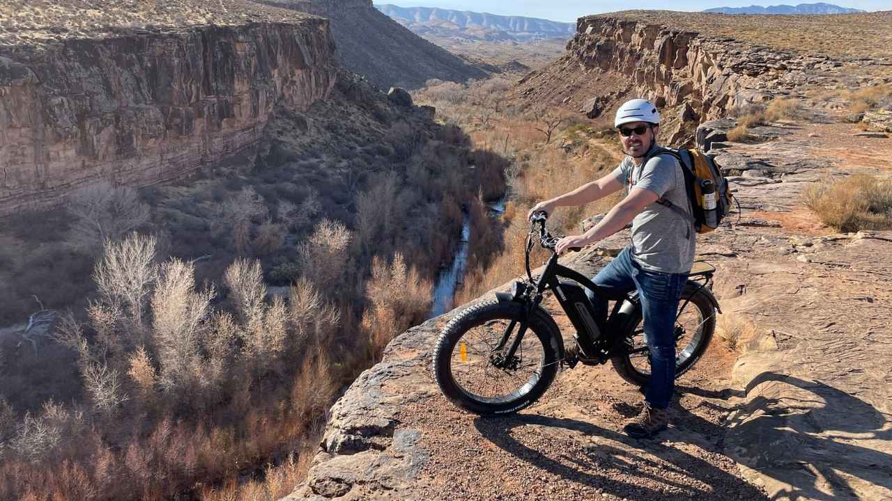 A man riding a e-bike in mountains