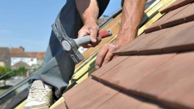 A guy working on a roof