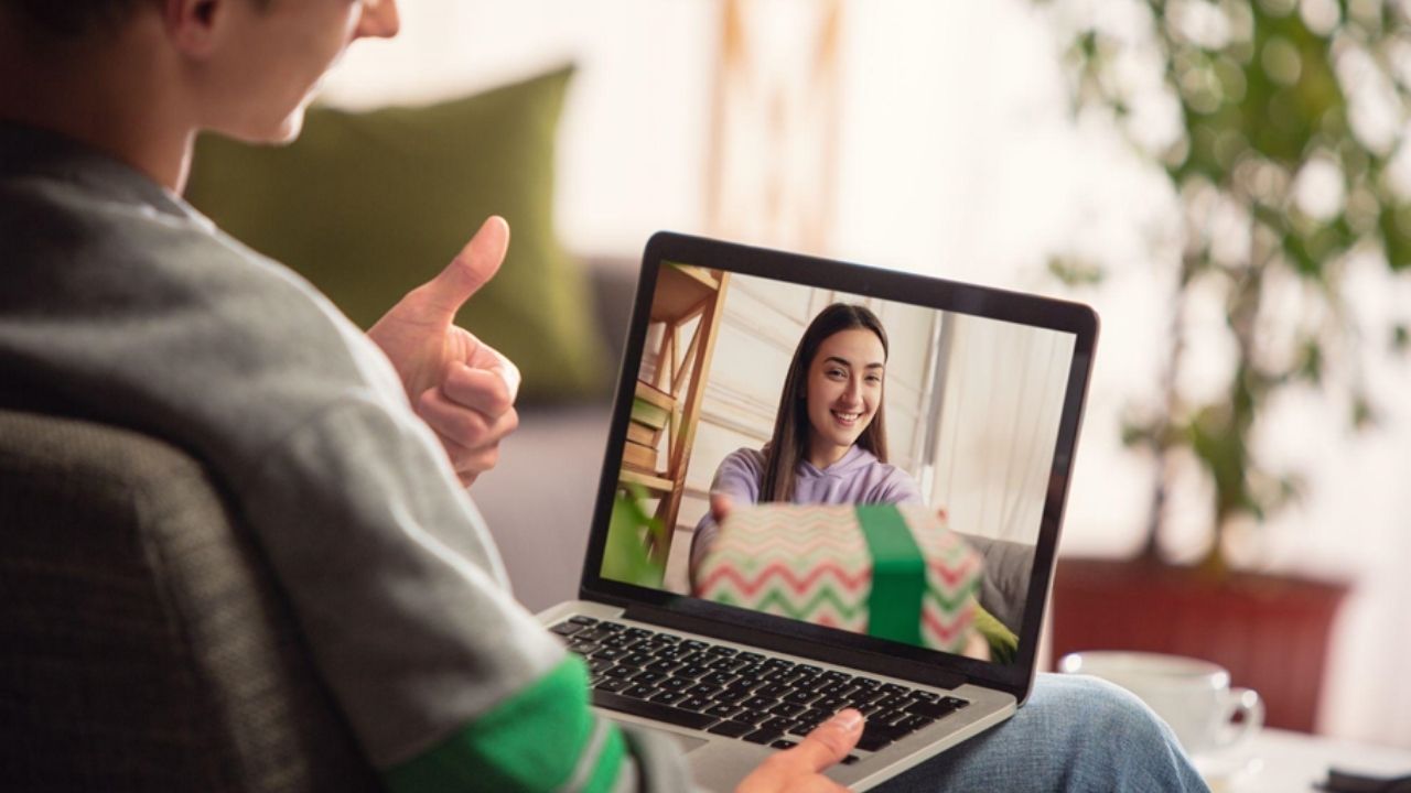 A guy using webcam on a macbook