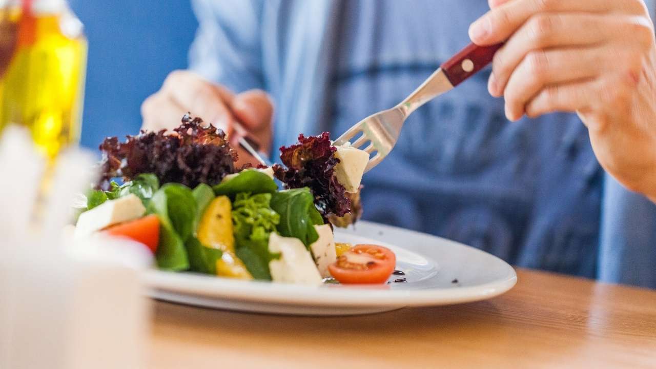 guy eating salad