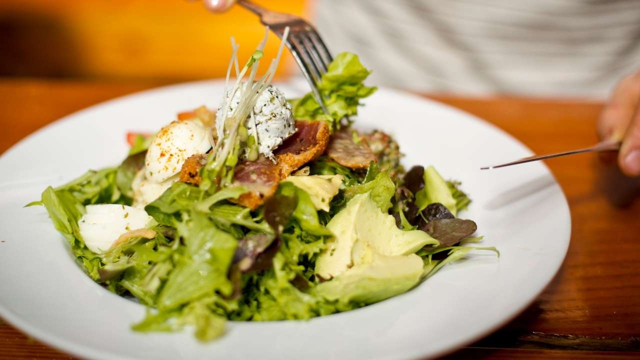 guy eating salad