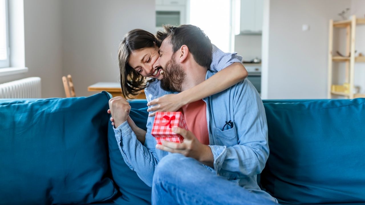 girl giving gift to her boyfriend