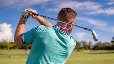 A guy playing golf