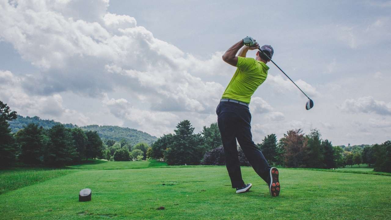 Guy playing golf