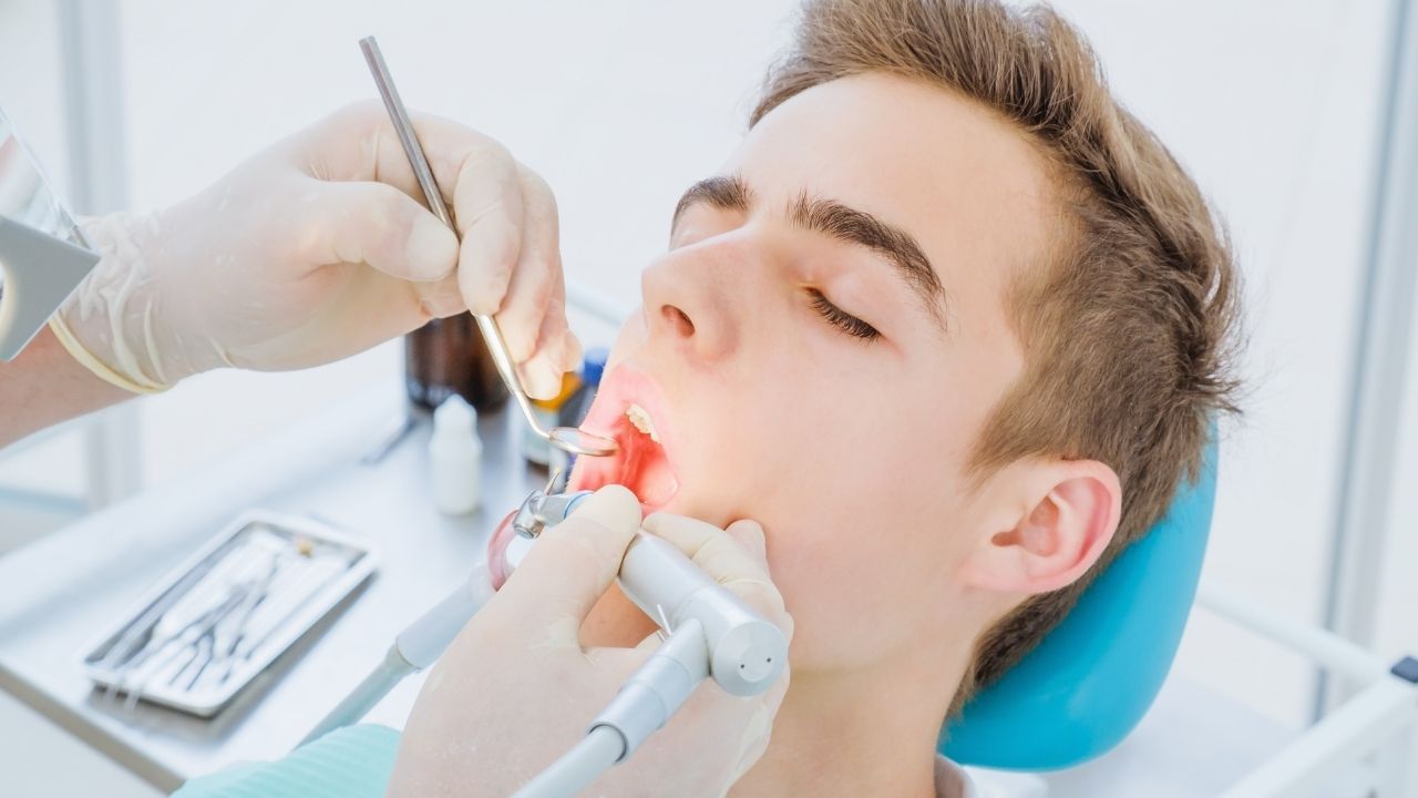 Guy undergoing root canal procedure