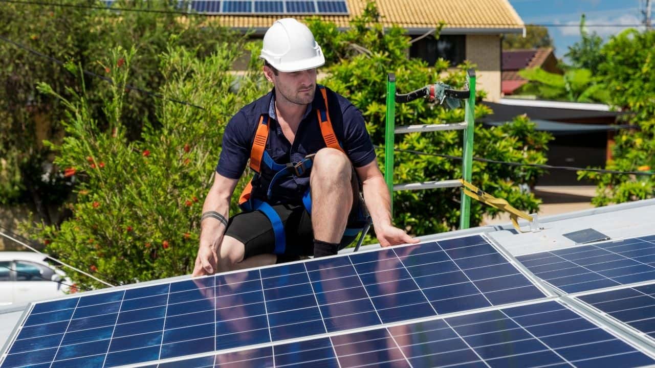 A guy working on solar panels