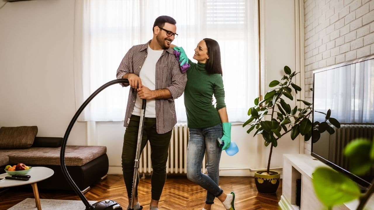 Couple cleaning home