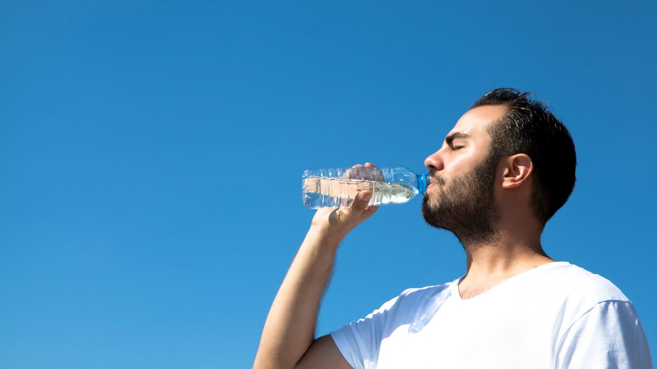 man drinking water