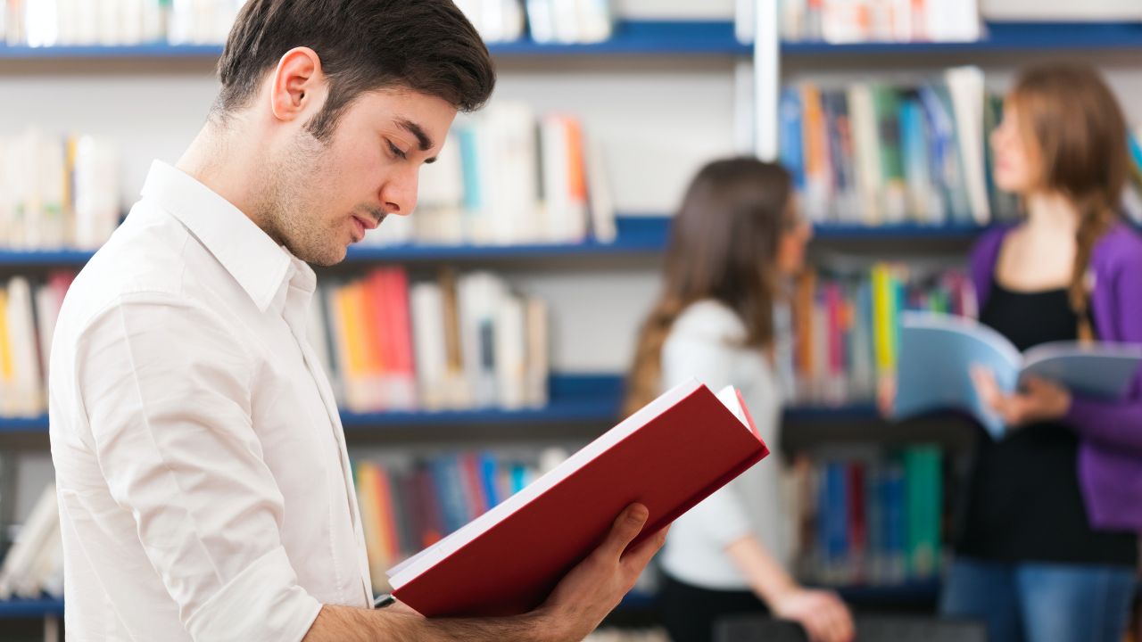 A guy reading a publication