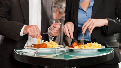 man and woman eating food