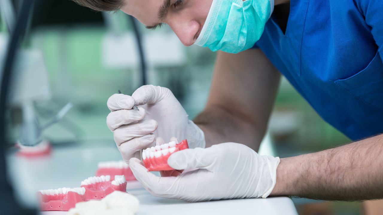 doctor checking Dentures