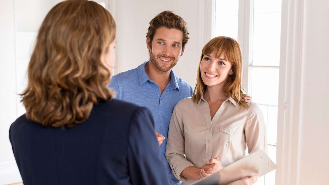 couple with real estate agent