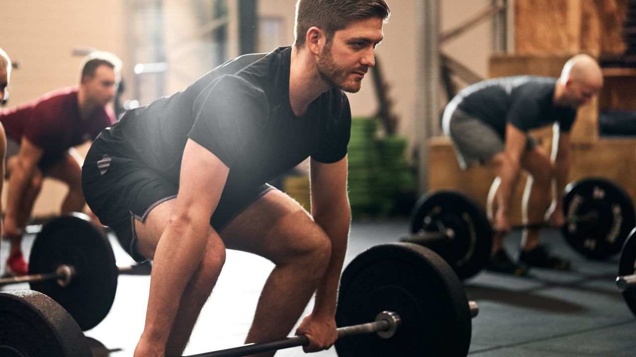 men doing deadlift in the gym