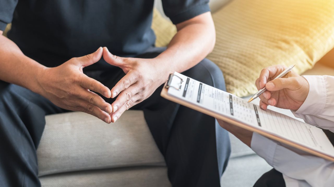 male patient consulting with a doctor regarding mental health