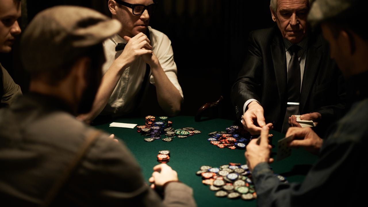 men playing poker at table