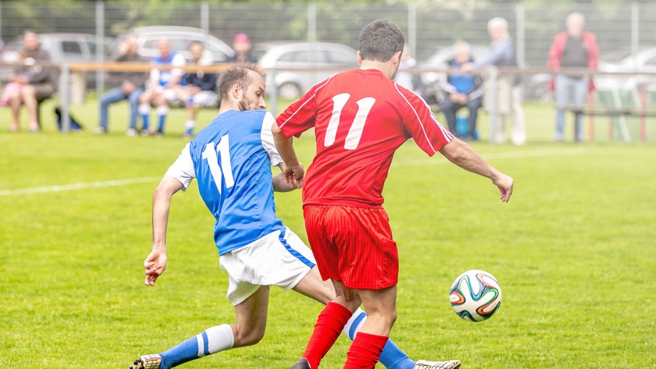 soccer player striking the ball