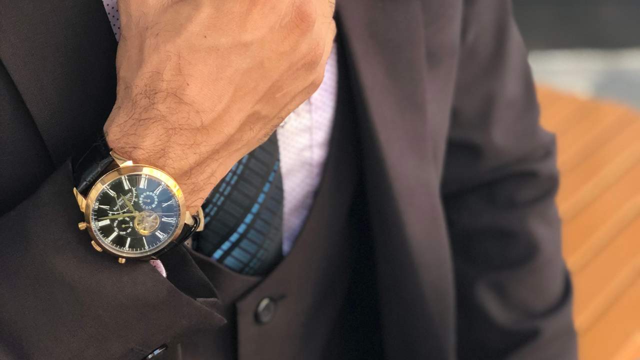 guy wearing a suit and watch