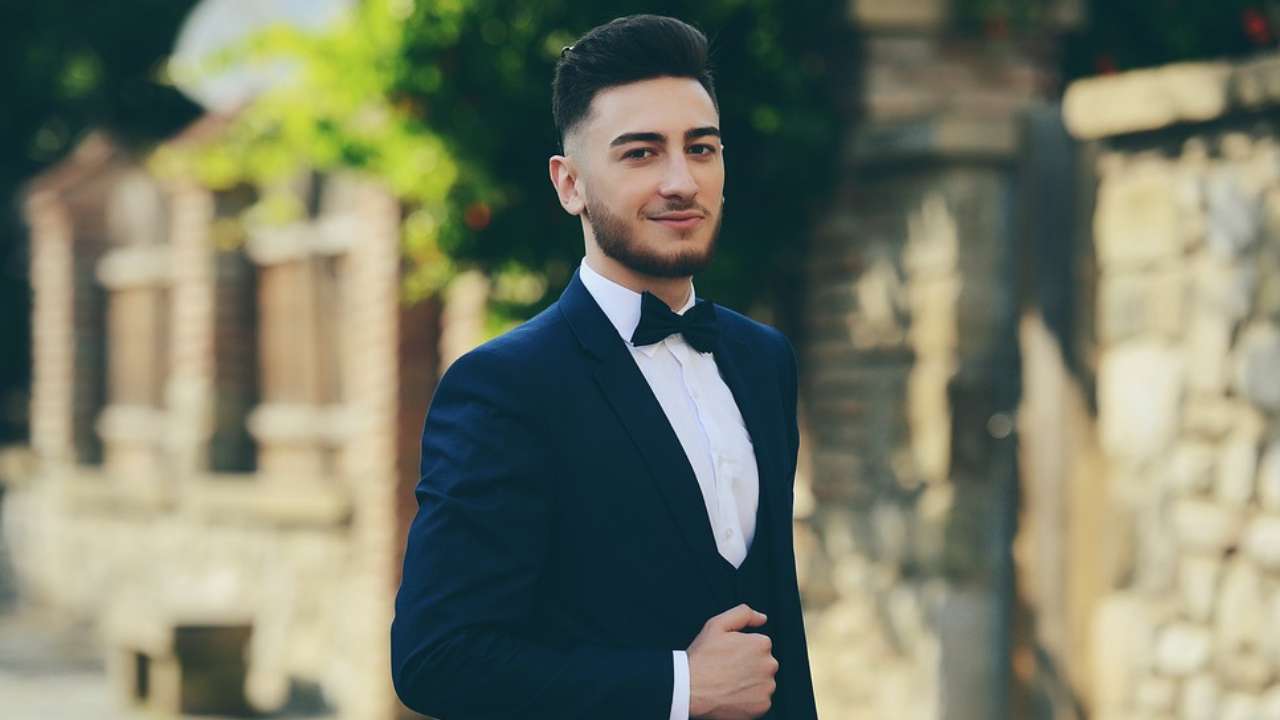 a guy wearing Bowtie with a suit