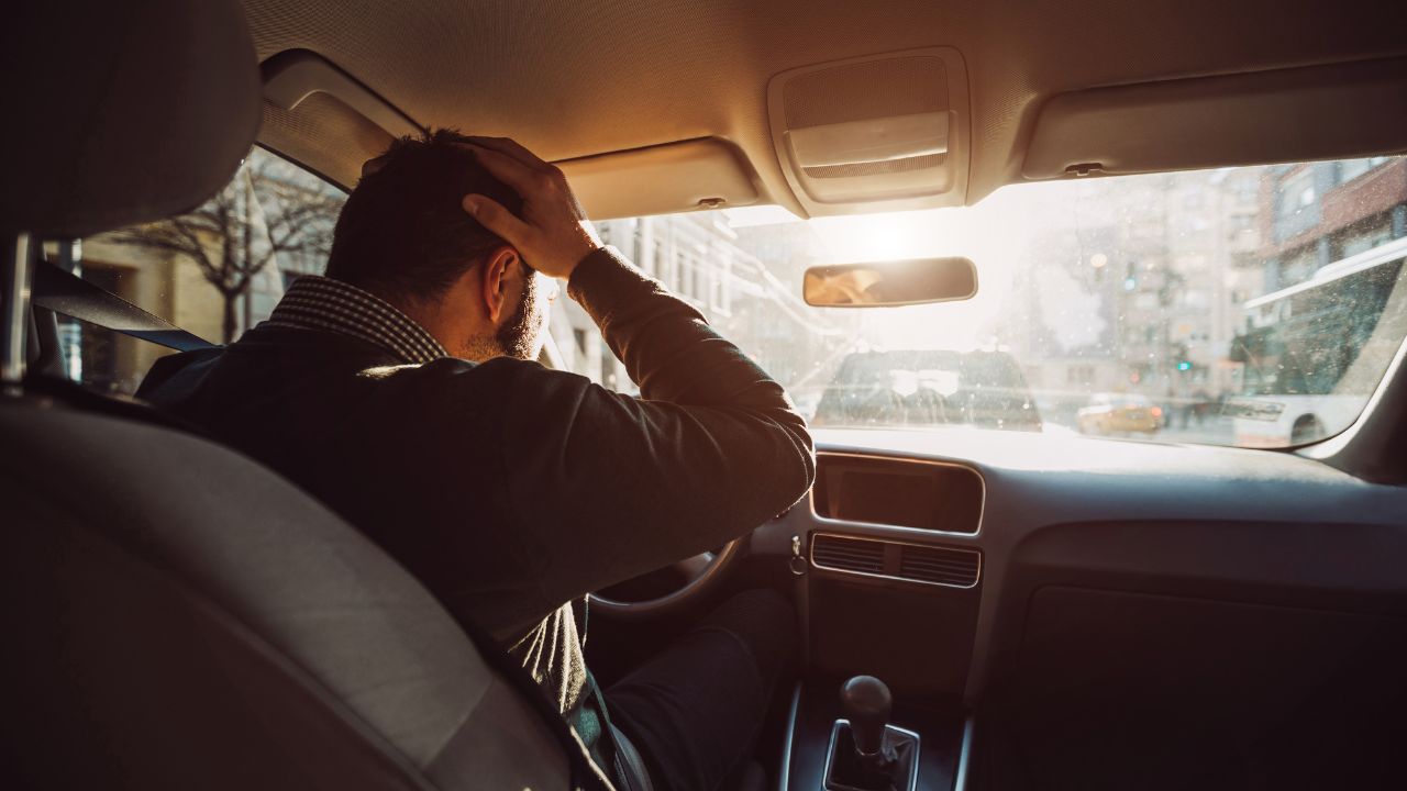 guy driving car angry