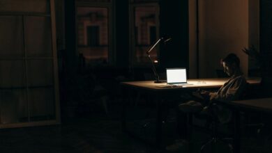 Guy using laptop at night