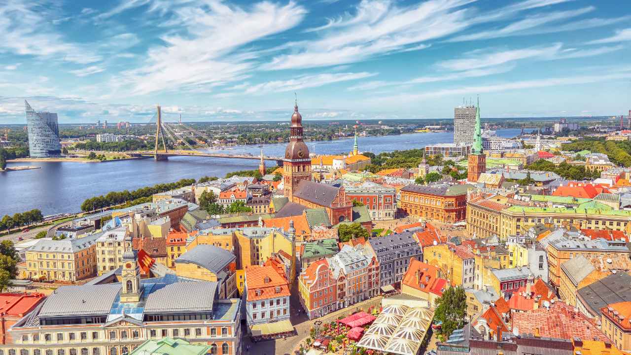 A splendid day view of the old town in Riga, Latvia, one of the best places to visit for history enthusiasts looking to find affordable travel experiences