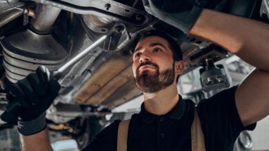 mechanic checking car suspension