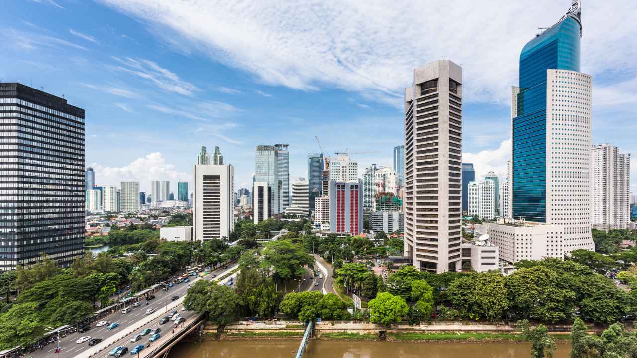 The vibrant city skyline of Jakarta, Indonesia, a place where tradition and modernity meet affordably