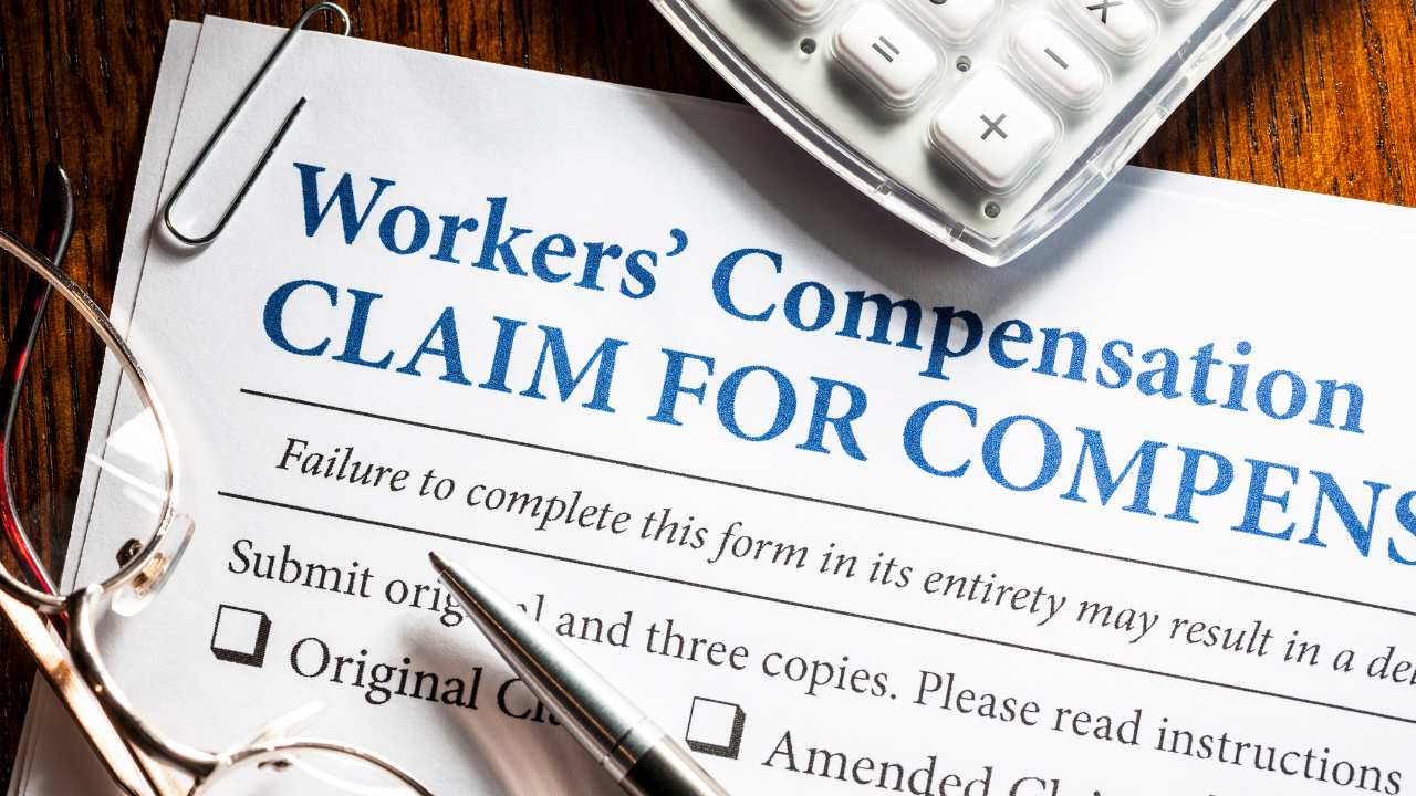 manager giving worker form for compensation for the injury worker had