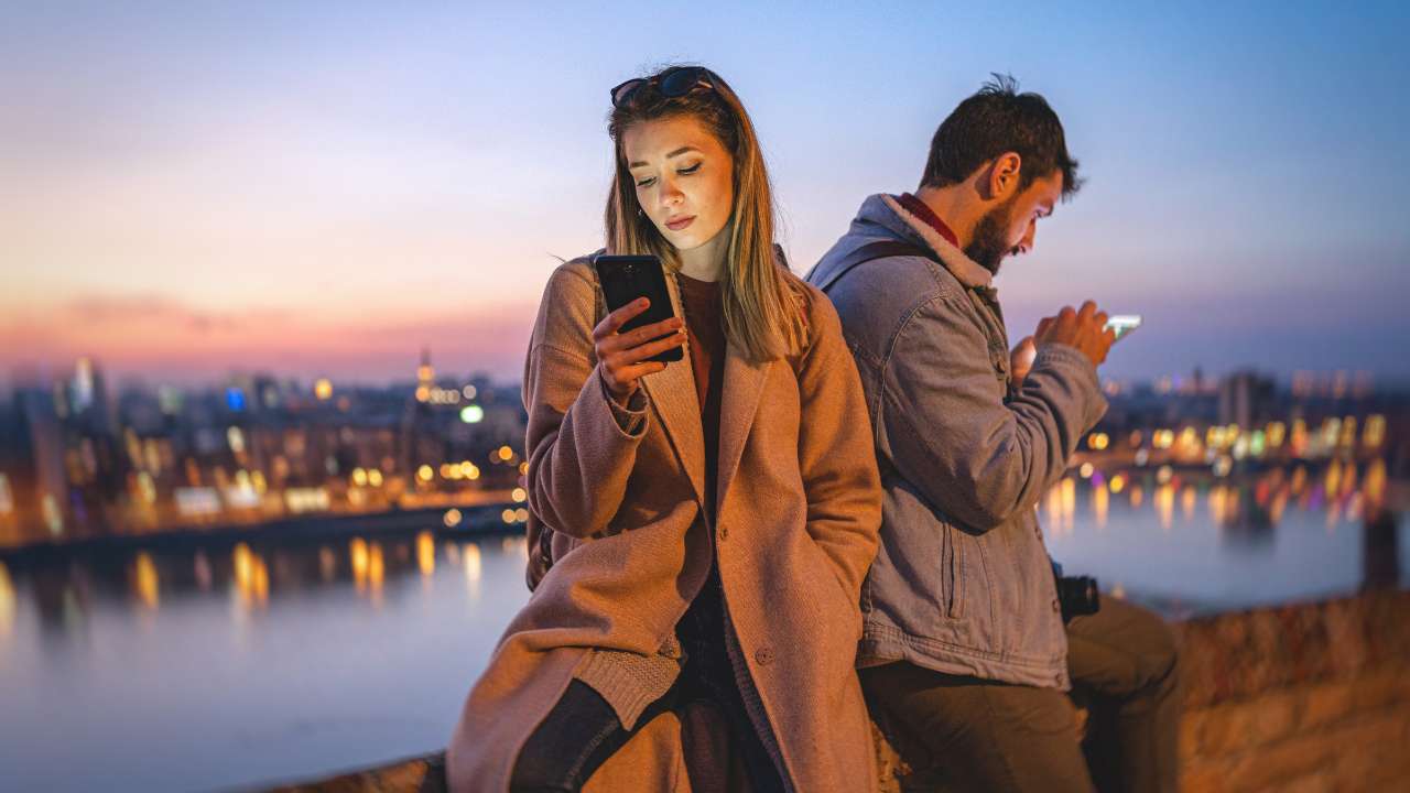 bored couple using social media