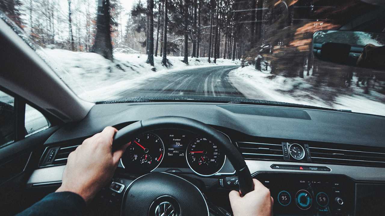 guy driving a car