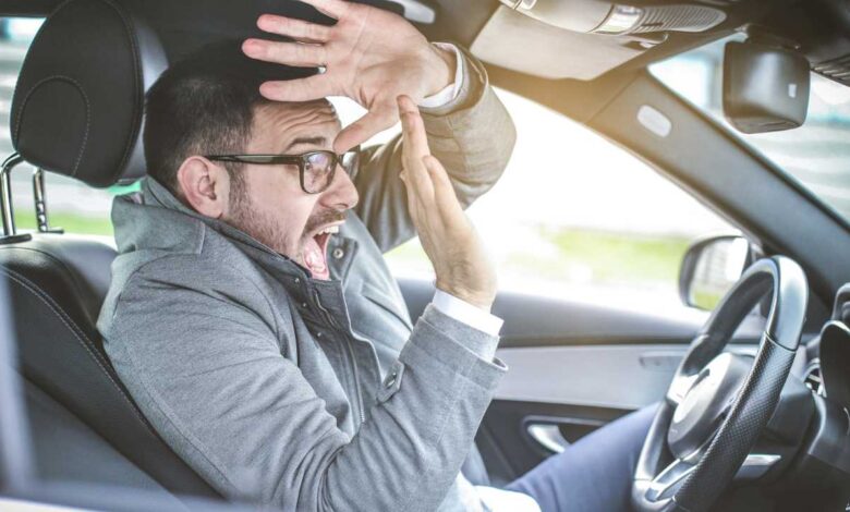 guy sitting in a car scared before a crash