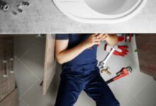 Plumbing Experts working in a home